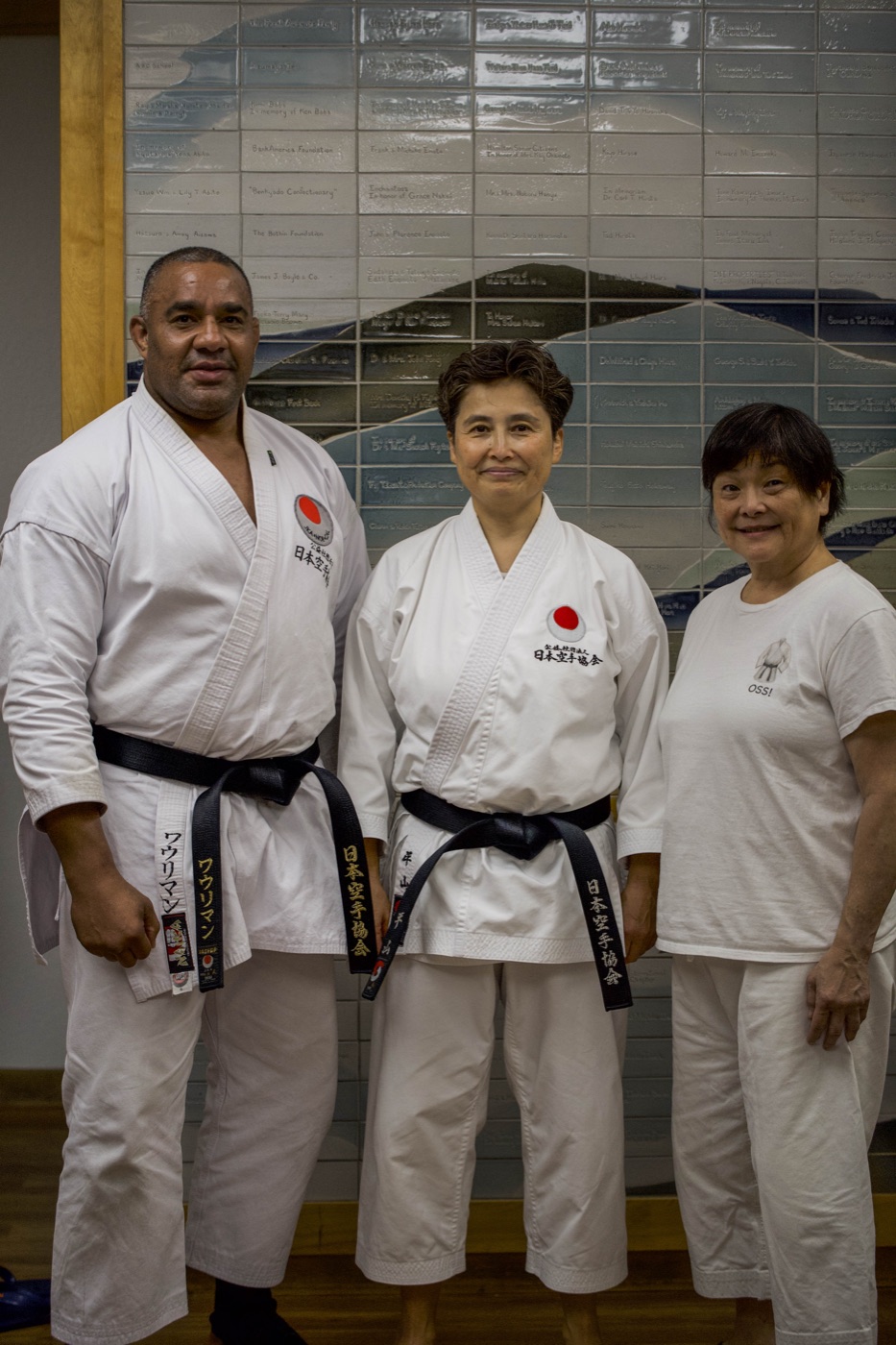 Sensei Hirayama with two fellow black-belt instructors at the camp