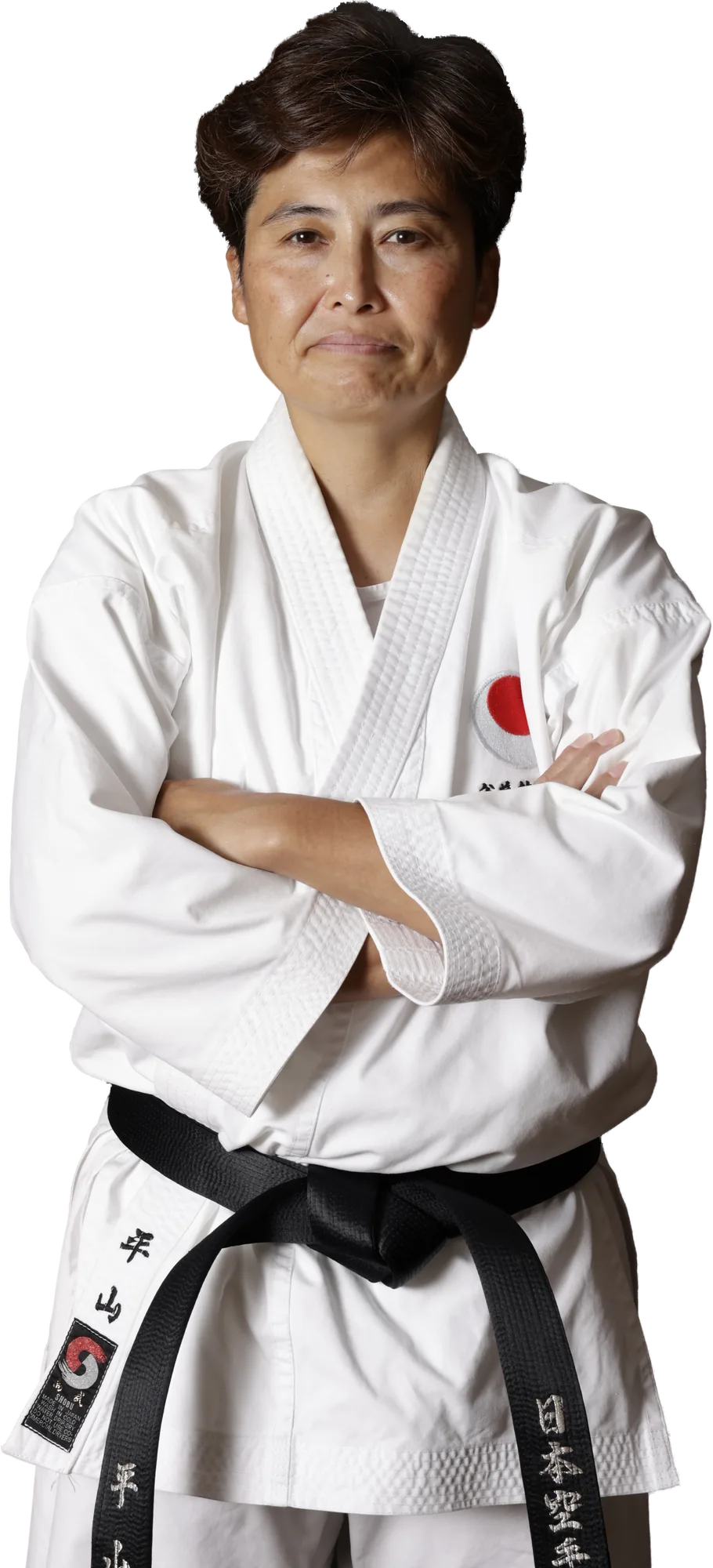Yuko Hirayama Sensei in karate gi, arms crossed