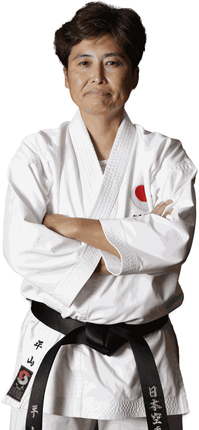 Yuko Hirayama Sensei in karate gi, arms crossed