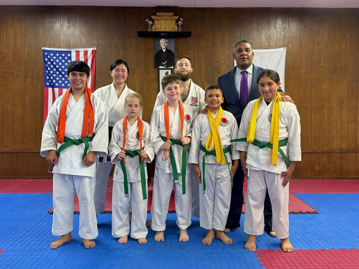 Kids program graduation with new belts