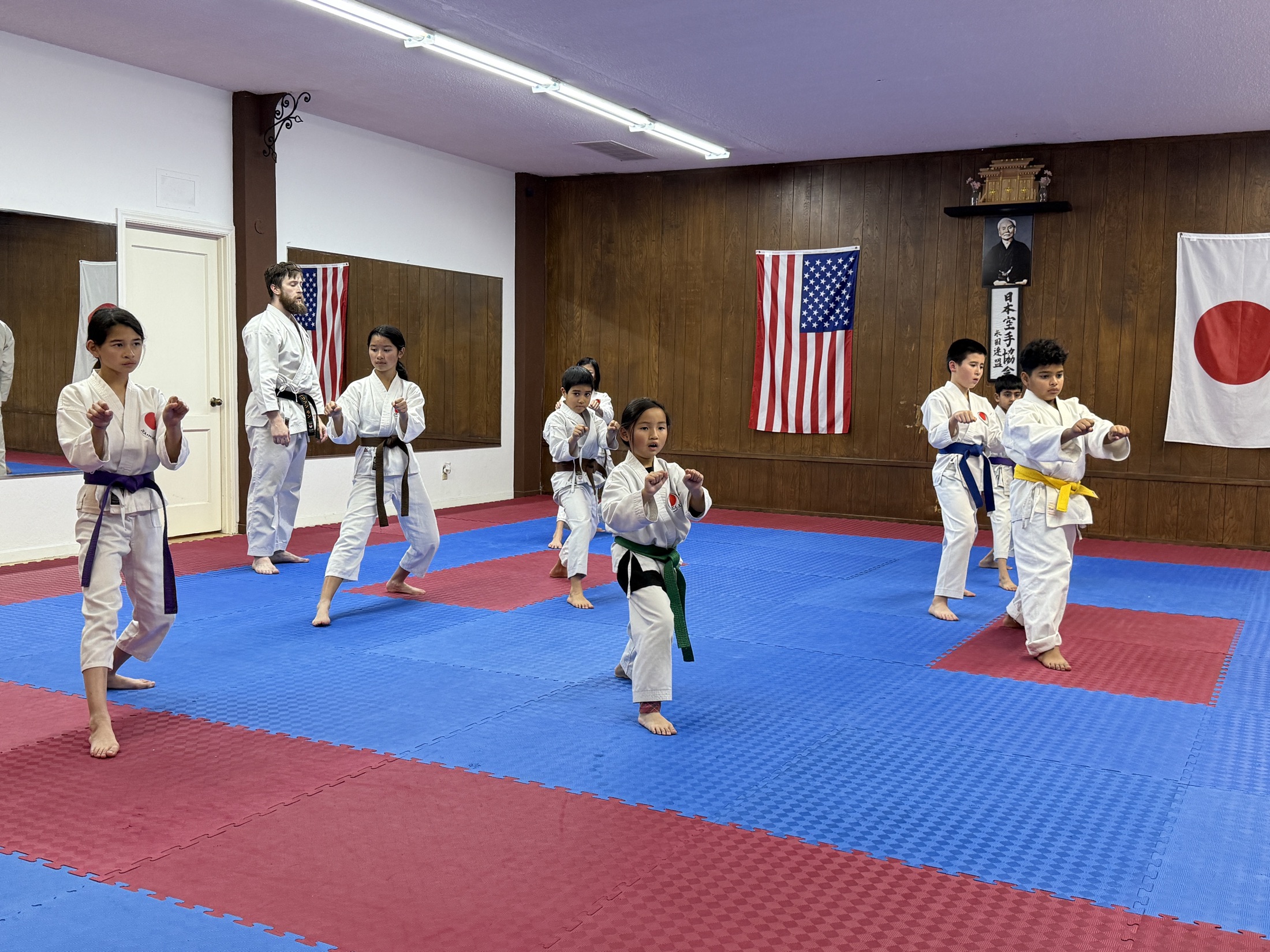 Youth class training on the mats at the JKA NorCal dojo