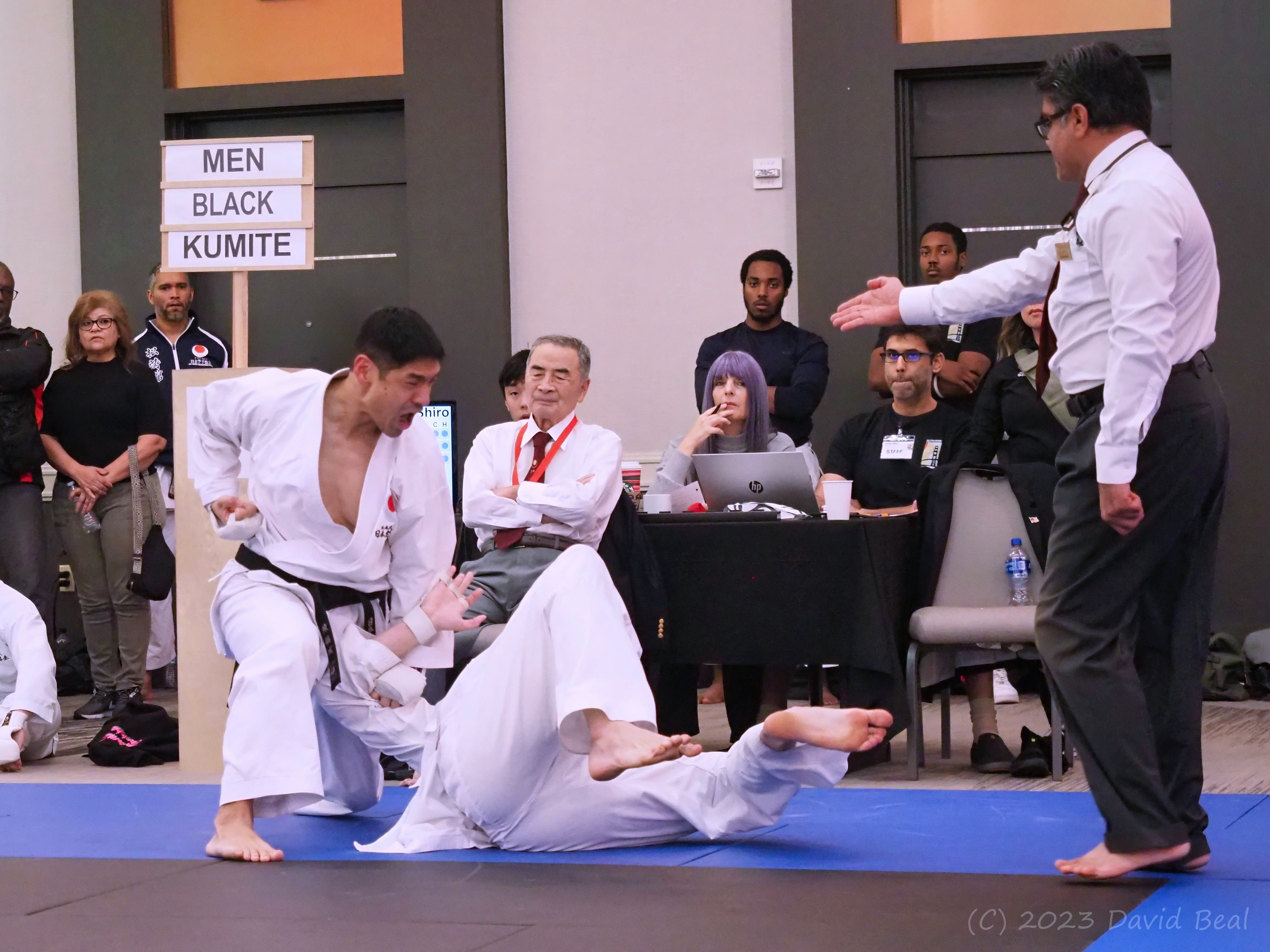 Men's black belt kumite match at a JKA tournament